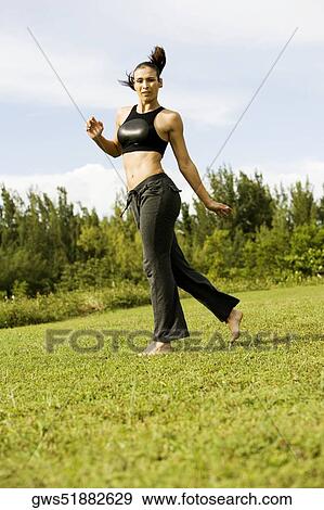 Young woman practicing martial arts View Large Photo Image Stock Photo - Young woman practicing martial arts. Fotosearch