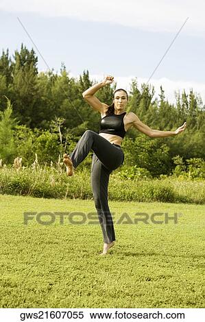 Young woman practicing martial arts View Large Photo Image Stock Photography - Young woman practicing martial arts. Fotosearch