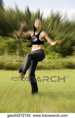Young woman practicing martial arts View Large Photo Image Stock Photography - Young woman practicing martial arts. Fotosearch