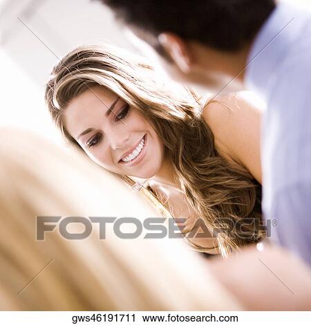 Young woman with her friends View Large Photo Image Stock Image - Young woman with her friends. Fotosearch