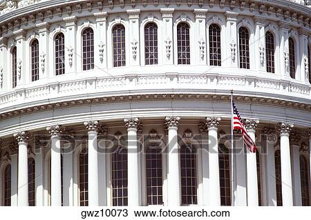 American flag in front of a government building, Capitol Building, Washington DC, USA View Large Photo Image Stock Image - American flag in front of a government building, Capitol Building, Washington DC, USA. Fotosearch
