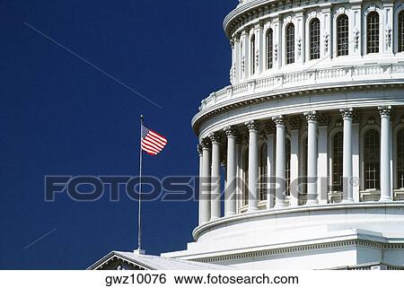 American flag in front of a government building, Capitol Building, Washington DC, USA View Large Photo Image Stock Photograph - American flag in front of a government building, Capitol Building, Washington DC, USA. Fotosearch
