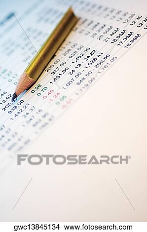 Broken pencil on a financial page View Large Photo Image Picture - Broken pencil on a financial page. Fotosearch