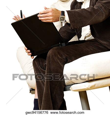 Stock Photograph - Businessman and a businesswoman discussing in front of a laptop. Fotosearch