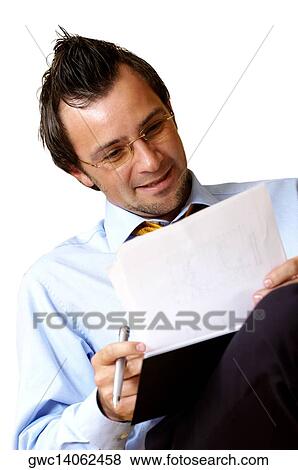 Businessman reading documents View Large Photo Image Stock Photo - Businessman reading documents. Fotosearch