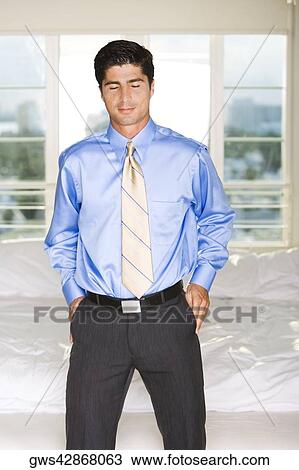 Businessman standing with his eyes closed View Large Photo Image Stock Image - Businessman standing with his eyes closed. Fotosearch