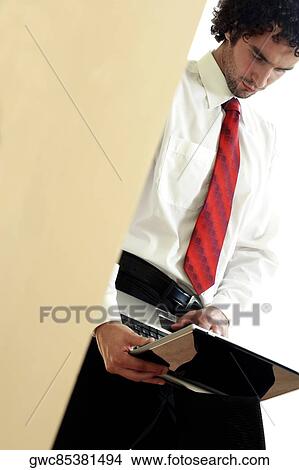 Picture - Businessman using a laptop. Fotosearch
