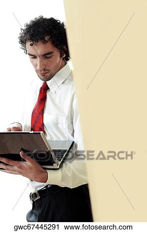 Businessman using a laptop View Large Photo Image Stock Image - Businessman using a laptop. Fotosearch