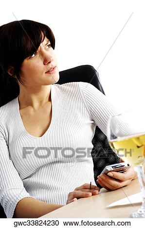 Businesswoman holding a personal data assistant View Large Photo Image Stock Image - Businesswoman holding a personal data assistant. Fotosearch