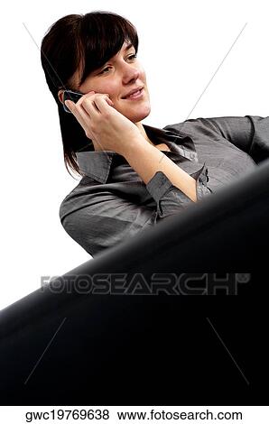Businesswoman talking on a mobile phone View Large Photo Image Stock Photo - Businesswoman talking on a mobile phone. Fotosearch