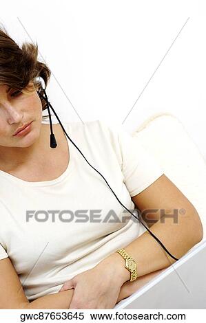 Businesswoman wearing a headset View Large Photo Image Stock Photography - Businesswoman wearing a headset. Fotosearch