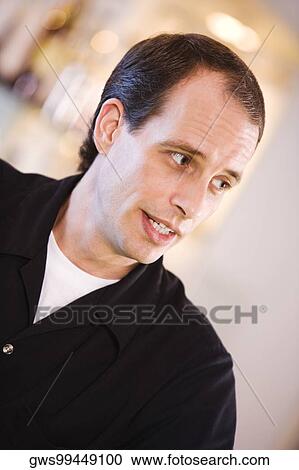 Stock Image - Close-up of a bartender. Fotosearch