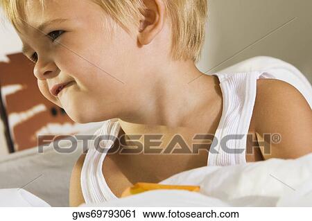 Close-up of a boy smiling View Large Photo Image Stock Image - Close-up of a boy smiling. Fotosearch