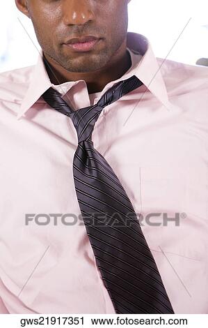 Close-up of a businessman in a bar View Large Photo Image Stock Image - Close-up of a businessman in a bar. Fotosearch