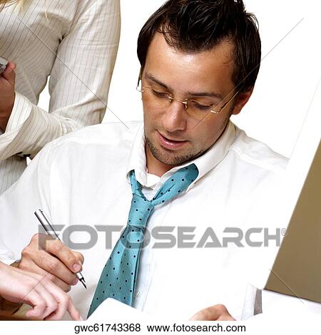 Close-up of a businessman looking down View Large Photo Image Stock Photo - Close-up of a businessman looking down. Fotosearch