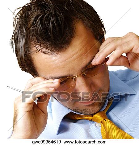 Stock Photo - Close-up of a businessman looking down. Fotosearch