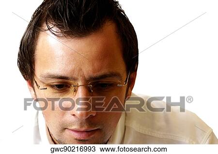 Close-up of a businessman looking serious View Large Photo Image Stock Image - Close-up of a businessman looking serious. Fotosearch