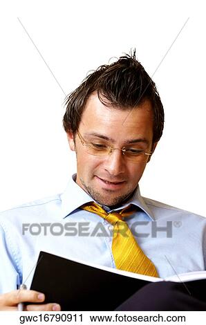 Close-up of a businessman reading a notebook View Large Photo Image Stock Image - Close-up of a businessman reading a notebook. Fotosearch