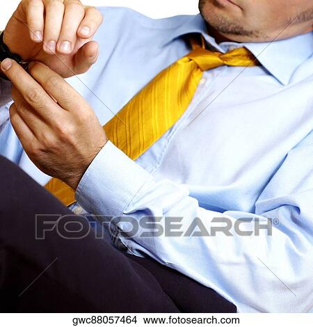 Close-up of a businessman wearing a wristwatch View Large Photo Image Picture - Close-up of a businessman wearing a wristwatch. Fotosearch