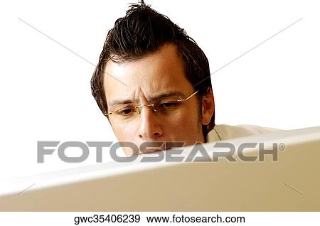 Stock Photo - Close-up of a businessman working on a computer. Fotosearch