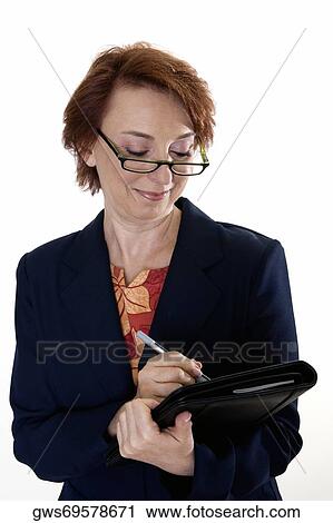Close-up of a businesswoman holding a file View Large Photo Image Stock Image - Close-up of a businesswoman holding a file. Fotosearch
