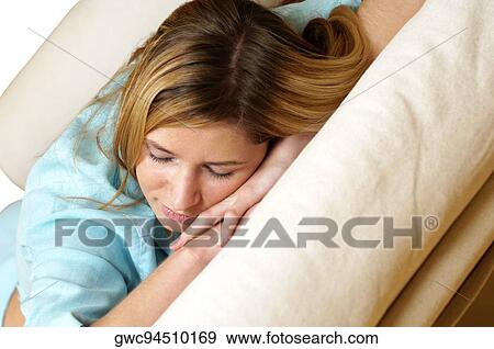 Stock Photo - Close-up of a businesswoman sleeping on a couch. Fotosearch