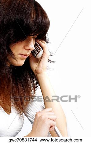 Picture - Close-up of a businesswoman talking on a mobile phone. Fotosearch