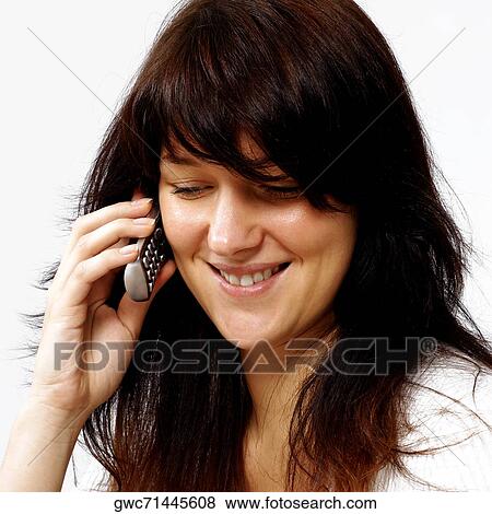 Stock Photo - Close-up of a businesswoman talking on a mobile phone. Fotosearch