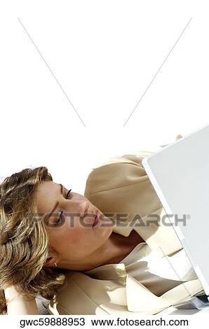 Close-up of a businesswoman using a laptop View Large Photo Image Stock Image - Close-up of a businesswoman using a laptop. Fotosearch
