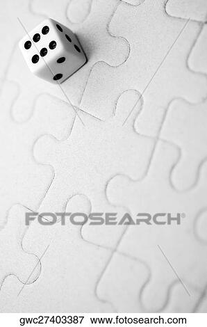 Close-up of a dice on a jigsaw puzzle View Large Photo Image Stock Photo - Close-up of a dice on a jigsaw puzzle. Fotosearch