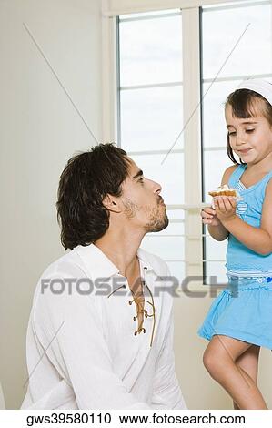 Close-up of a father and his daughter View Large Photo Image Stock Image - Close-up of a father and his daughter. Fotosearch