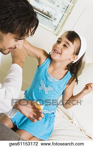 Close-up of a girl and her father View Large Photo Image Stock Image - Close-up of a girl and her father. Fotosearch