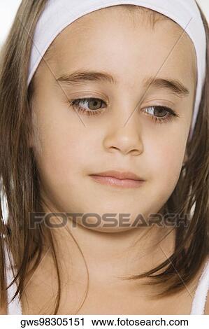 Stock Image - Close-up of a girl looking down. Fotosearch