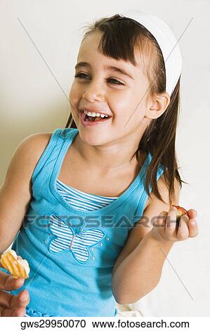 Close-up of a girl smiling View Large Photo Image Stock Image - Close-up of a girl smiling. Fotosearch