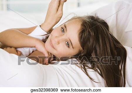 Stock Photo - Close-up of a girl smiling. Fotosearch