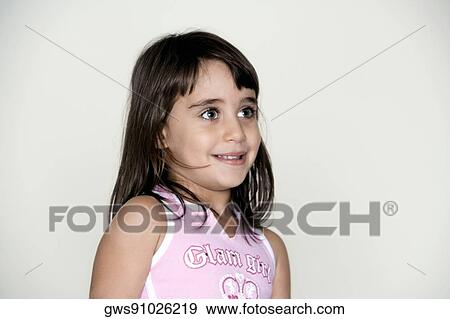 Close-up of a girl smiling View Large Photo Image Stock Photo - Close-up of a girl smiling. Fotosearch