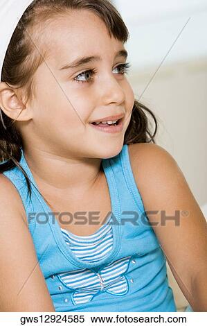 Close-up of a girl smiling View Large Photo Image Stock Photography - Close-up of a girl smiling. Fotosearch