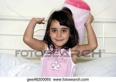 Close-up of a girl with her hands raised View Large Photo Image Stock Photography - Close-up of a girl with her hands raised. Fotosearch