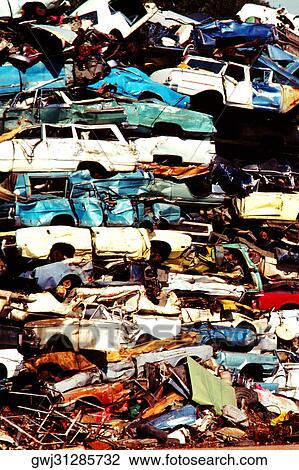 Close-up of a heap of cars in a junkyard View Large Photo Image Stock Image - Close-up of a heap of cars in a junkyard. Fotosearch