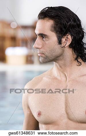 Close-up of a mid adult man at the poolside View Large Photo Image Stock Image - Close-up of a mid adult man at the poolside. Fotosearch