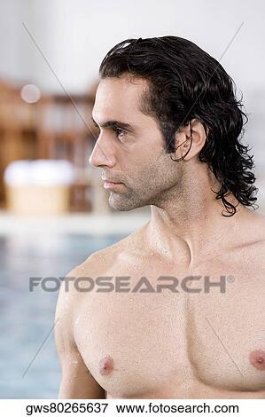 Close-up of a mid adult man at the poolside View Large Photo Image Stock Photo - Close-up of a mid adult man at the poolside. Fotosearch