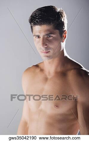 Close-up of a mid adult man bare chested View Large Photo Image Stock Image - Close-up of a mid adult man bare chested. Fotosearch