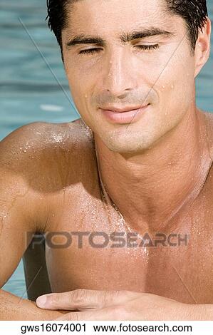Stock Image - Close-up of a mid adult man in a swimming pool. Fotosearch