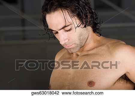 Close-up of a mid adult man looking down View Large Photo Image Stock Image - Close-up of a mid adult man looking down. Fotosearch