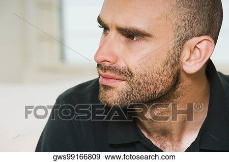 Close-up of a mid adult man looking sideways View Large Photo Image Stock Photo - Close-up of a mid adult man looking sideways. Fotosearch