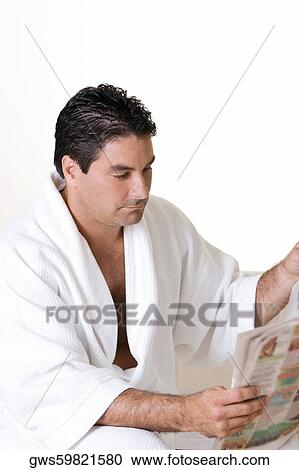 Close-up of a mid adult man reading a newspaper View Large Photo Image Stock Image - Close-up of a mid adult man reading a newspaper. Fotosearch