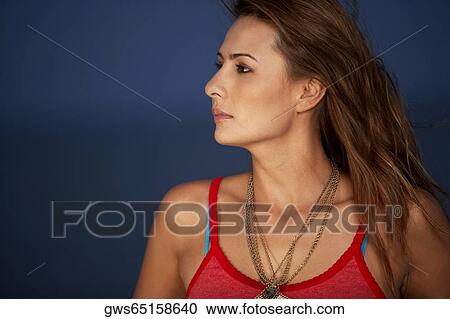 Close-up of a mid adult woman looking sideways View Large Photo Image Stock Image - Close-up of a mid adult woman looking sideways. Fotosearch