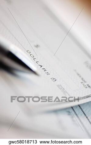 Close-up of a pen on a check View Large Photo Image Stock Image - Close-up of a pen on a check. Fotosearch