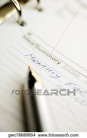 Close-up of a pen on a personal organizer View Large Photo Image Picture - Close-up of a pen on a personal organizer. Fotosearch