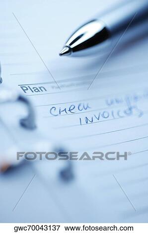 Close-up of a pen on a personal organizer View Large Photo Image Stock Photo - Close-up of a pen on a personal organizer. Fotosearch